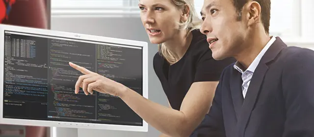 Man Woman In Front Of Monitor