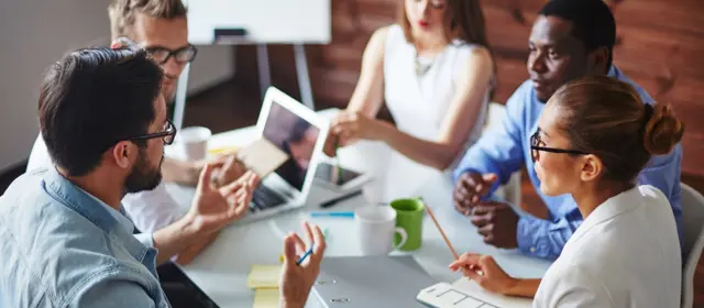People Working Together At A Table