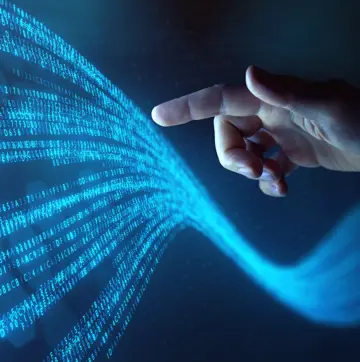 Hand Touches Flowing Stream Of Binary Code