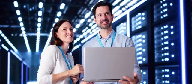 Woman and Men Talking in Data Center