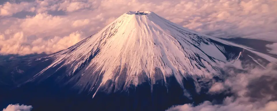 Snow Capped Mountain Peak During Sunrise