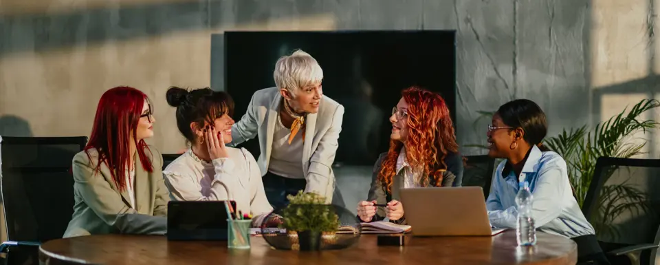 Women Around Table Discussing