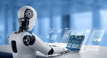 Robot Sitting In Front Of Virtual Screen