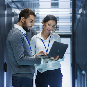 Woman Man In Data Center Before Server Rack