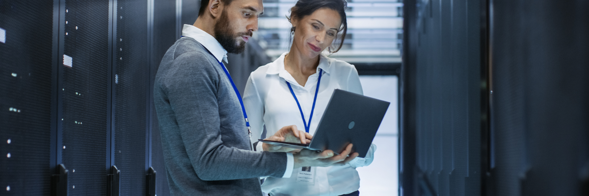 Woman Man In Data Center Before Server Rack