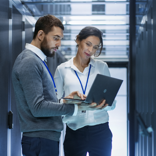 Woman Man In Data Center Before Server Rack