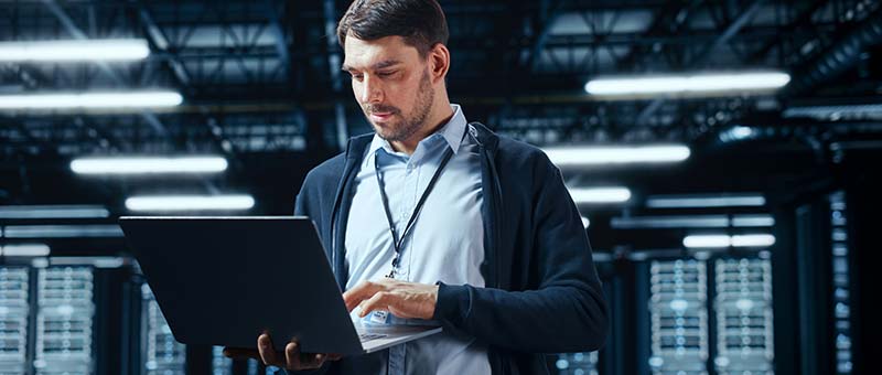 Man Standing With Notebook