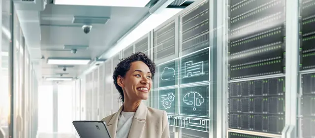 Woman In Datacenter Holding Tablet