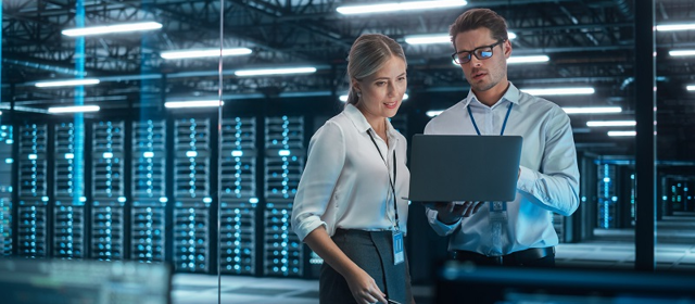 Two People In A Server Room In Connection With Information Security