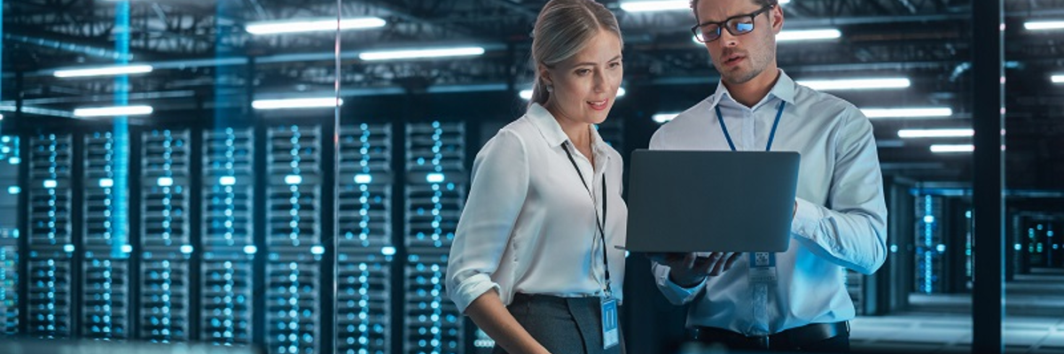 Two People In A Server Room In Connection With Information Security