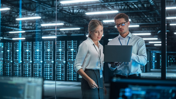 Two People In A Server Room In Connection With Information Security