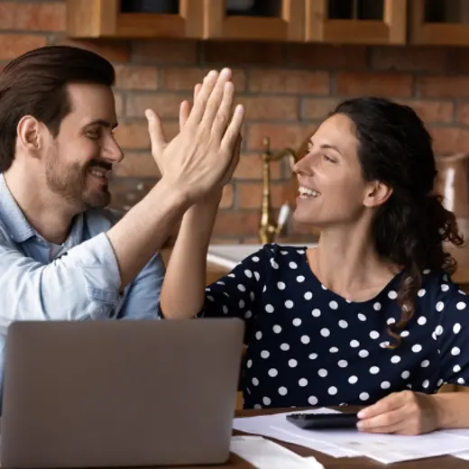 Two People High Five Each Other