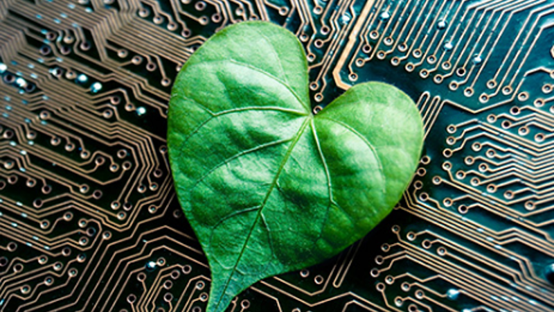 Green Leaf On Circuit Board Symbolizes Green Technology