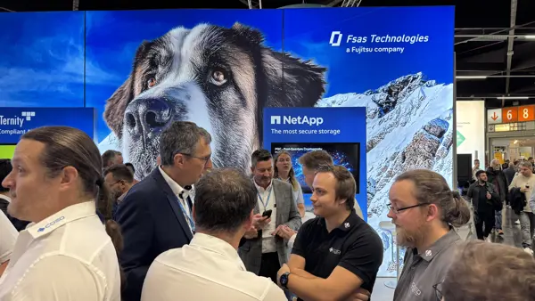 2025 People Standing In Front Of A Booth Netapp