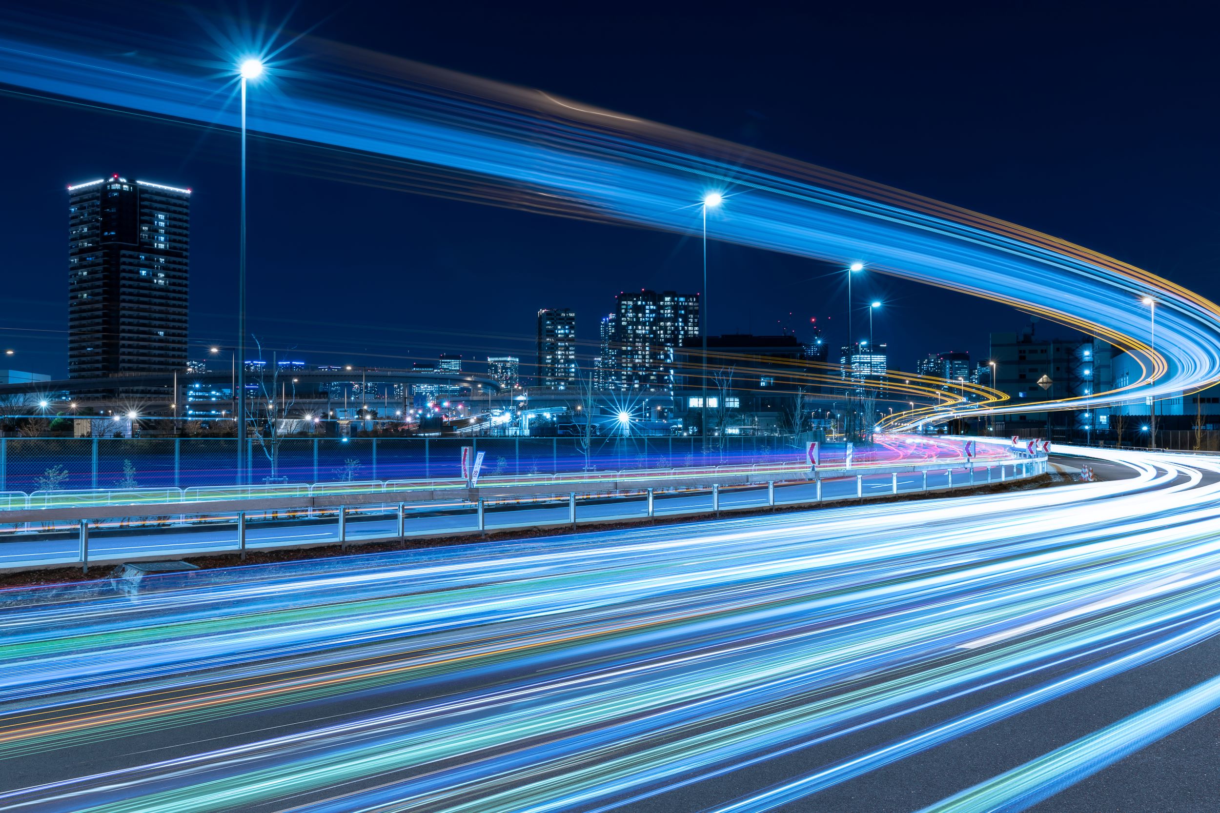 Nighttime Skyline With Highway