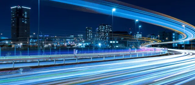Nighttime Skyline With Highway