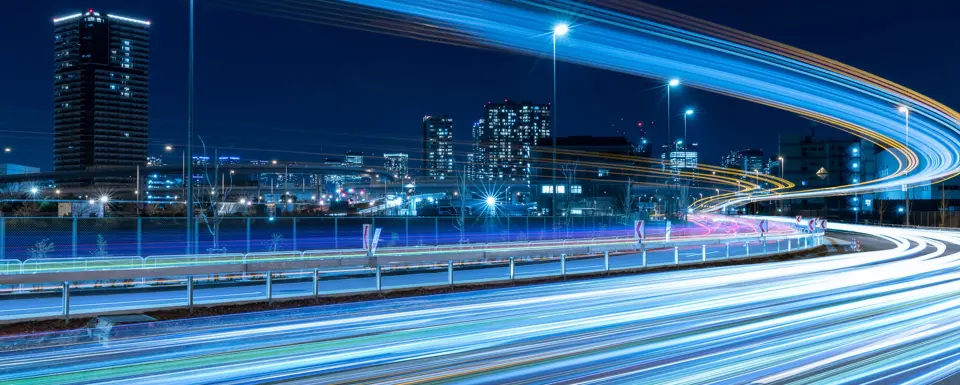 Nighttime Skyline With Highway