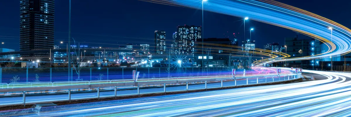 Nighttime Skyline With Highway