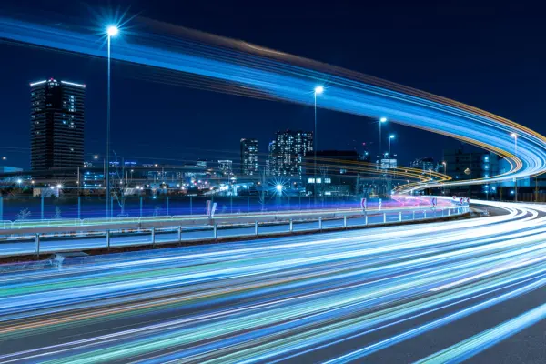 Nighttime Skyline With Highway