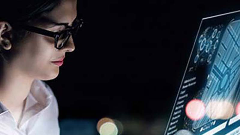 Woman Glances At Monitor