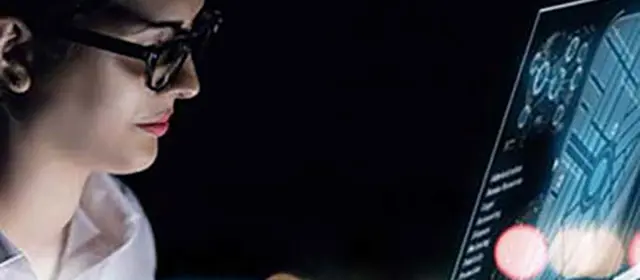 Woman Glances At Monitor